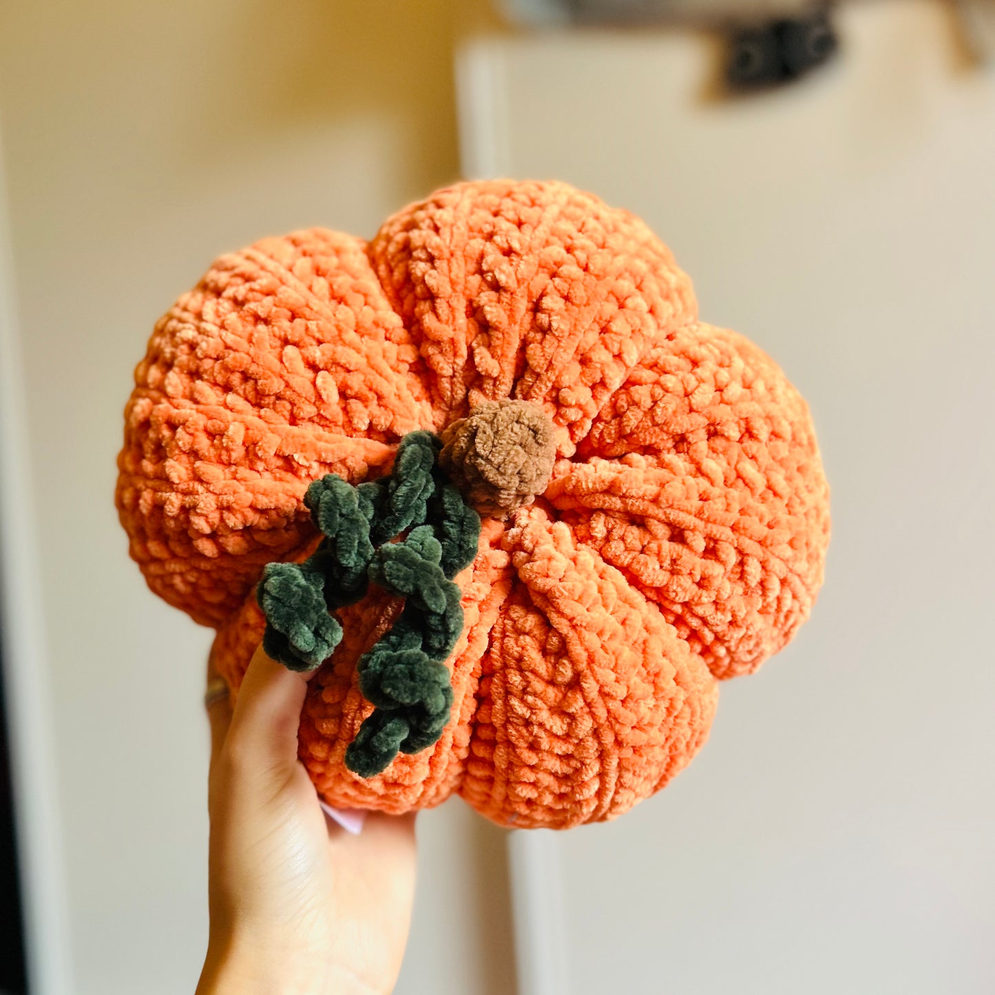 Crochet orange pumpkin pillow