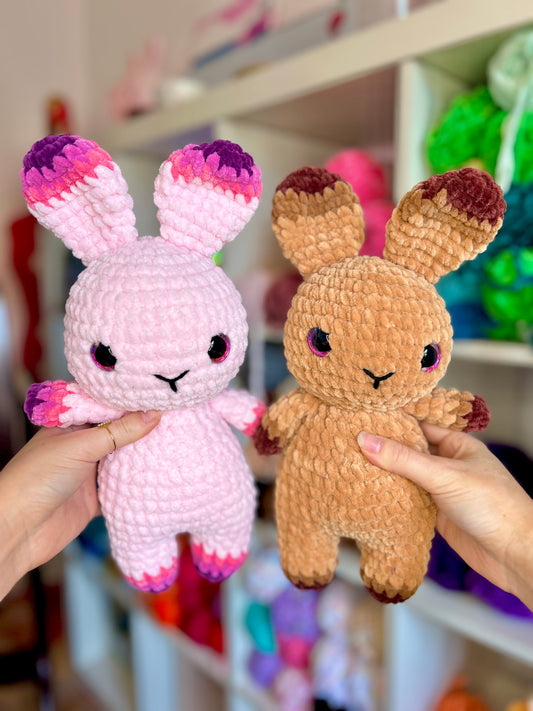 Pink and fuschia crochet bunny rabbit with pink. eyes and brown crochet bunny rabbit with pink eyes